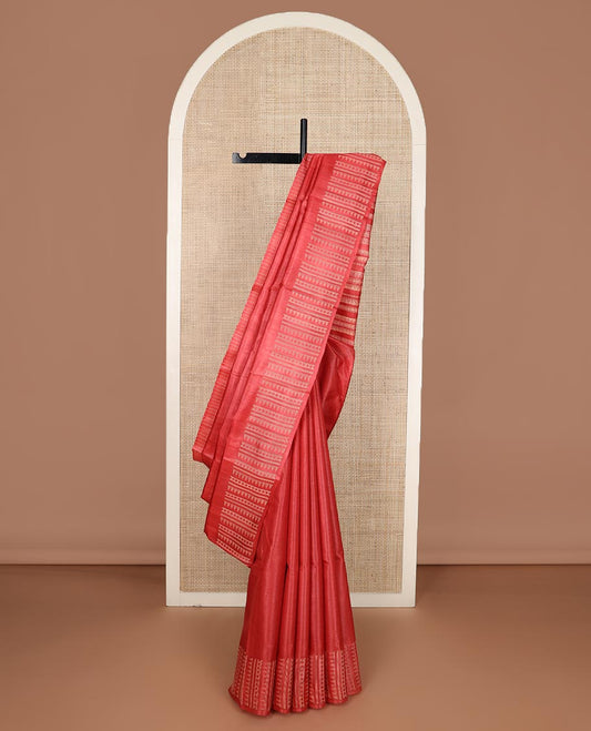 Pink plain tussar silk saree, self border and pallu features geometric patterns, and temple motifs