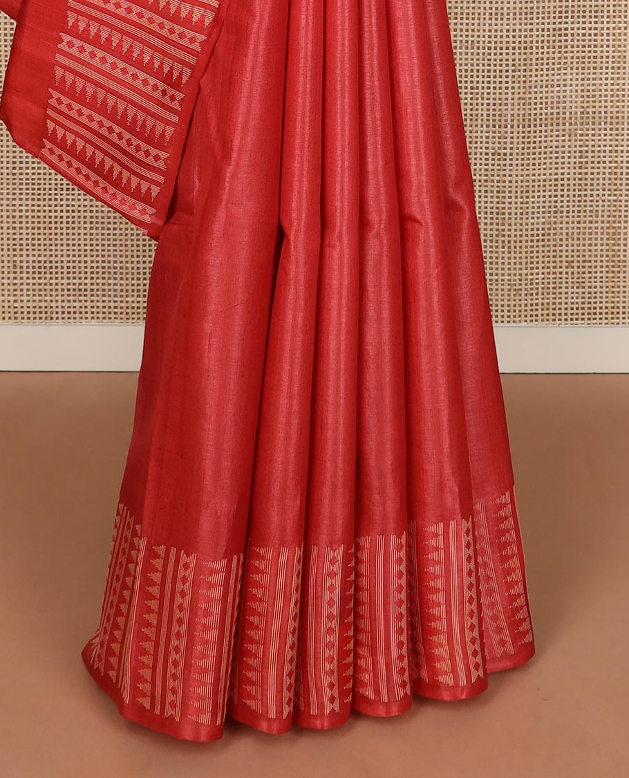 Pink plain tussar silk saree, self border and pallu features geometric patterns, and temple motifs