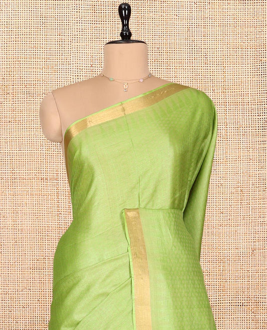 Parrot Green Sparsely Textured Tussar Silk Saree, a Subtle Piping Border, a Self-Pallu, and a Matching Blouse