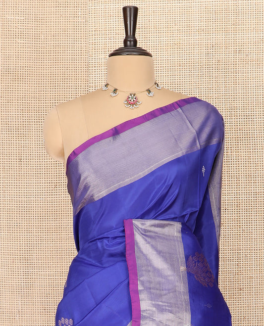 Blue Semi Uppada Saree Gracefully Embellished with Zari Buttas, Complemented by a Contrasting Bavanji Border, Pallu of Intricate Ogee Designs, and Paired with a Contrast Blouse