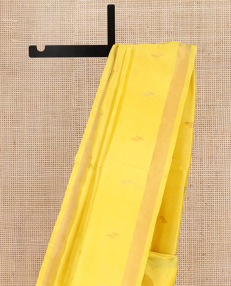 Yellow Uppada Silk Saree, Sparsely Woven with Buttas All Over Its Body, Subtle Bavanji Border, Pallu Steeped with Paisley Buttas, and Paired with a Matching Blouse