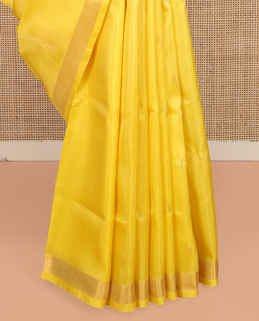 Yellow Uppada Silk Saree, Sparsely Woven with Buttas All Over Its Body, Subtle Bavanji Border, Pallu Steeped with Paisley Buttas, and Paired with a Matching Blouse