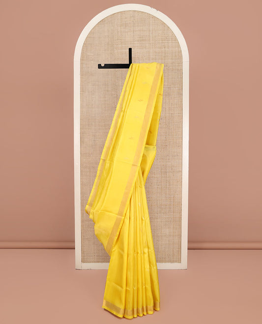Yellow Uppada Silk Saree, Sparsely Woven with Buttas All Over Its Body, Subtle Bavanji Border, Pallu Steeped with Paisley Buttas, and Paired with a Matching Blouse
