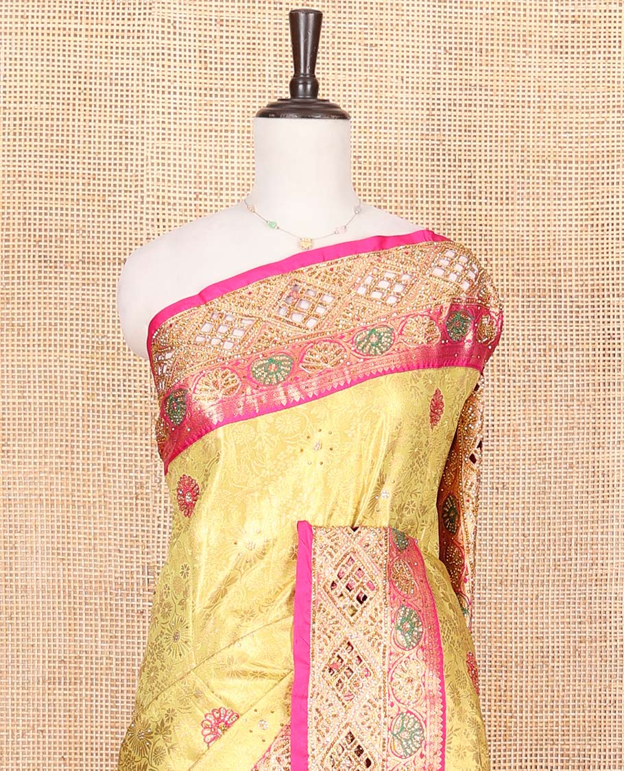 Yellow Vastrakala Silk Saree, Highlighted with Jacquard and Embroidery Work, Complemented by Contrast Zari and Cut Embroidered Border, Gleaming Floral Jaal Stone Work Pallu, and Paired with Contrast Heavy Embroidered Blouse