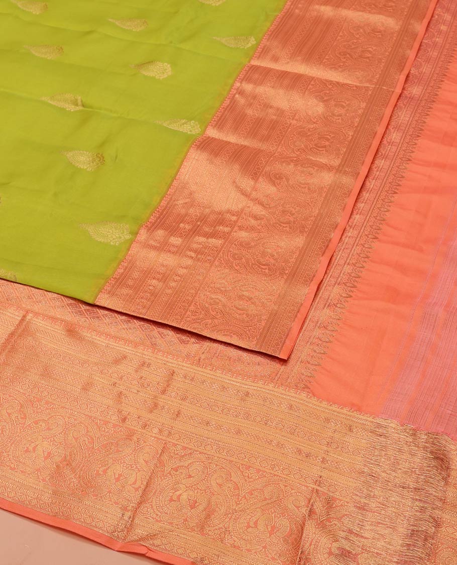 Green Vasundhara Lite-Silk Mix Saree, Embellished with Zari Buttas on Its Body, Complemented by Contrast Border of Mayil Kann, Laddu Kamalam, and Mayil Designs, Gracefully Woven Pallu of Jaal Designs, and Paired with a Contrast Blouse