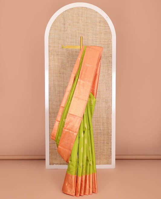 Green Vasundhara Lite-Silk Mix Saree, Embellished with Zari Buttas on Its Body, Complemented by Contrast Border of Mayil Kann, Laddu Kamalam, and Mayil Designs, Gracefully Woven Pallu of Jaal Designs, and Paired with a Contrast Blouse