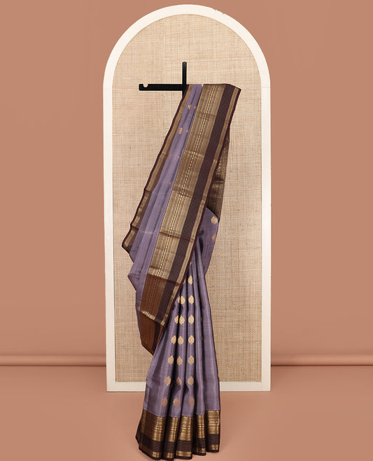 Grey Vasundhara Lite Silk Mix Saree, Richly Detailed with Zari Buttas on Its Body, Complemented by Contrast Border of Thilakam Mokku, Muthu, Banaras, Neli, and Rudraksham Designs, Grand Pallu of Geometric Designs, and Paired with a Contrast Blouse