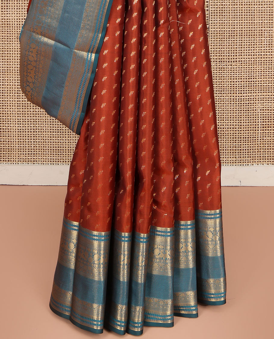Rust Vasundhara Lite Silk Mix Saree, Elevated with Zari Buttas on Its Body, Complemented by a Contrast Traditional Zari Border of Mayil and Chakram Designs, Pallu Features Chevron Designs, and Paired with a Contrast Blouse