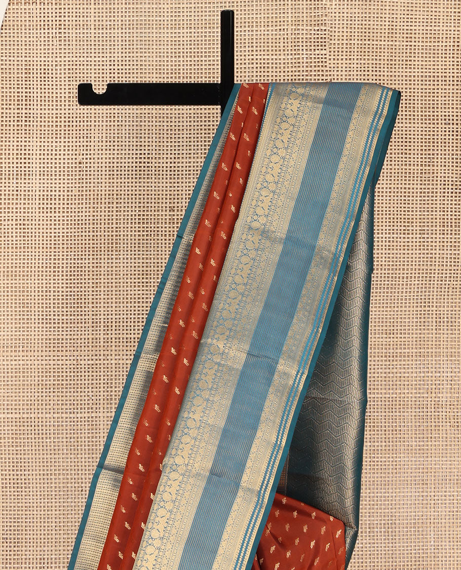 Rust Vasundhara Lite Silk Mix Saree, Elevated with Zari Buttas on Its Body, Complemented by a Contrast Traditional Zari Border of Mayil and Chakram Designs, Pallu Features Chevron Designs, and Paired with a Contrast Blouse