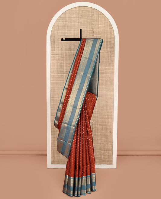 Rust Vasundhara Lite Silk Mix Saree, Elevated with Zari Buttas on Its Body, Complemented by a Contrast Traditional Zari Border of Mayil and Chakram Designs, Pallu Features Chevron Designs, and Paired with a Contrast Blouse