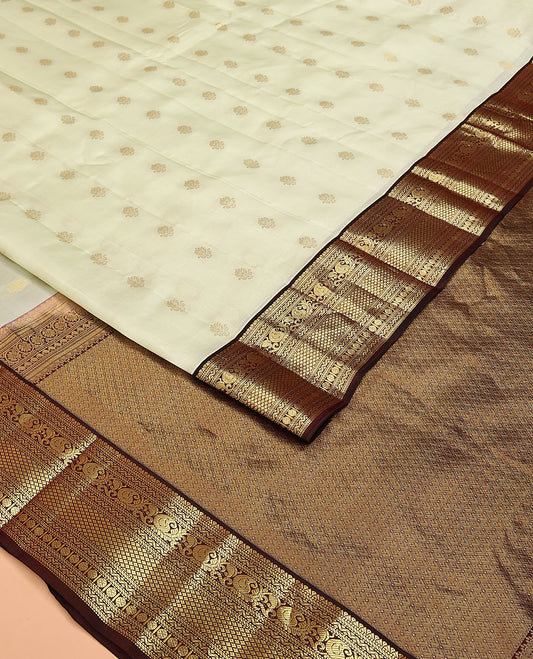 Cream Vasundhara Lite Silk Mix Saree, Enthralled with Zari Buttas on Its Body, Complemented by Contrast Border of Muthu, Banaras, Neli, Manga, Mayil Kann, and Rudraksham Designs, Grand Jaal Pallu, and Paired with a Contrast Blouse