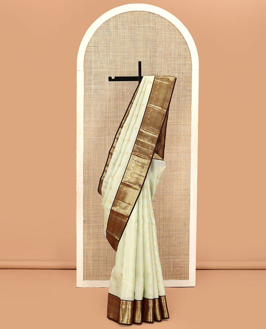 Cream Vasundhara Lite Silk Mix Saree, Enthralled with Zari Buttas on Its Body, Complemented by Contrast Border of Muthu, Banaras, Neli, Manga, Mayil Kann, and Rudraksham Designs, Grand Jaal Pallu, and Paired with a Contrast Blouse