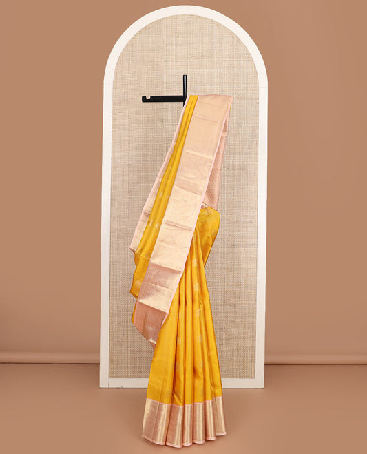 Yellow zari buttas and checked silk saree, contrast border of rekku, muthu, kathir, diamond, rudraksham, and floral designs, and jaal pallu