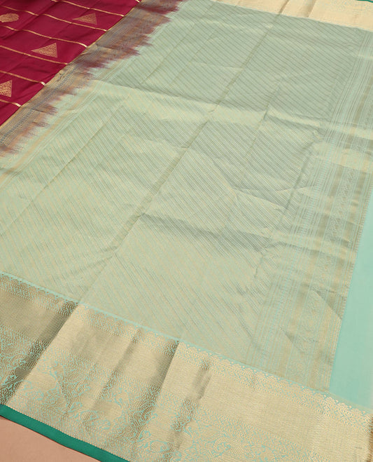 Maroon zari buttas silk saree, contrast border of yaali designs, and pallu of diagonal stripes
