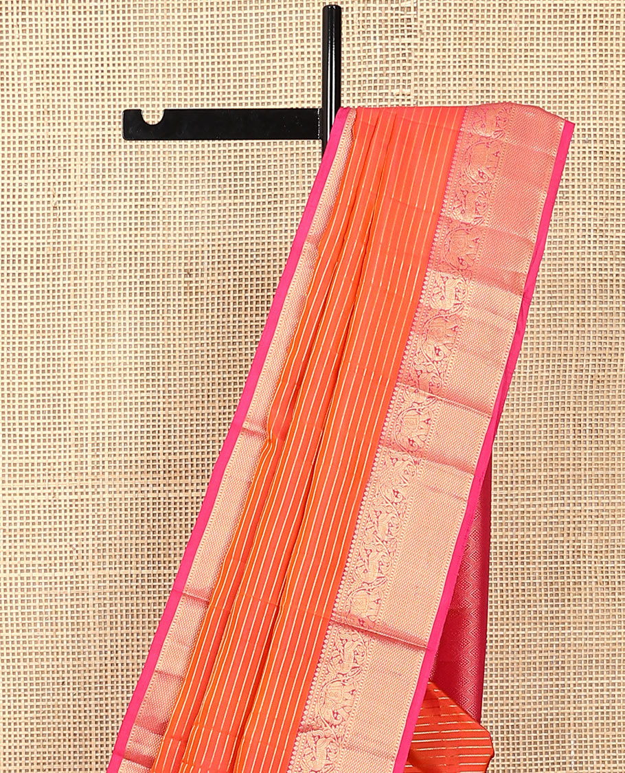 Orange zari striped Vasundhara silk saree, contrast border of thilakam mokku, yaanai, kuthirai, and kuyil kann designs, and jaal pallu