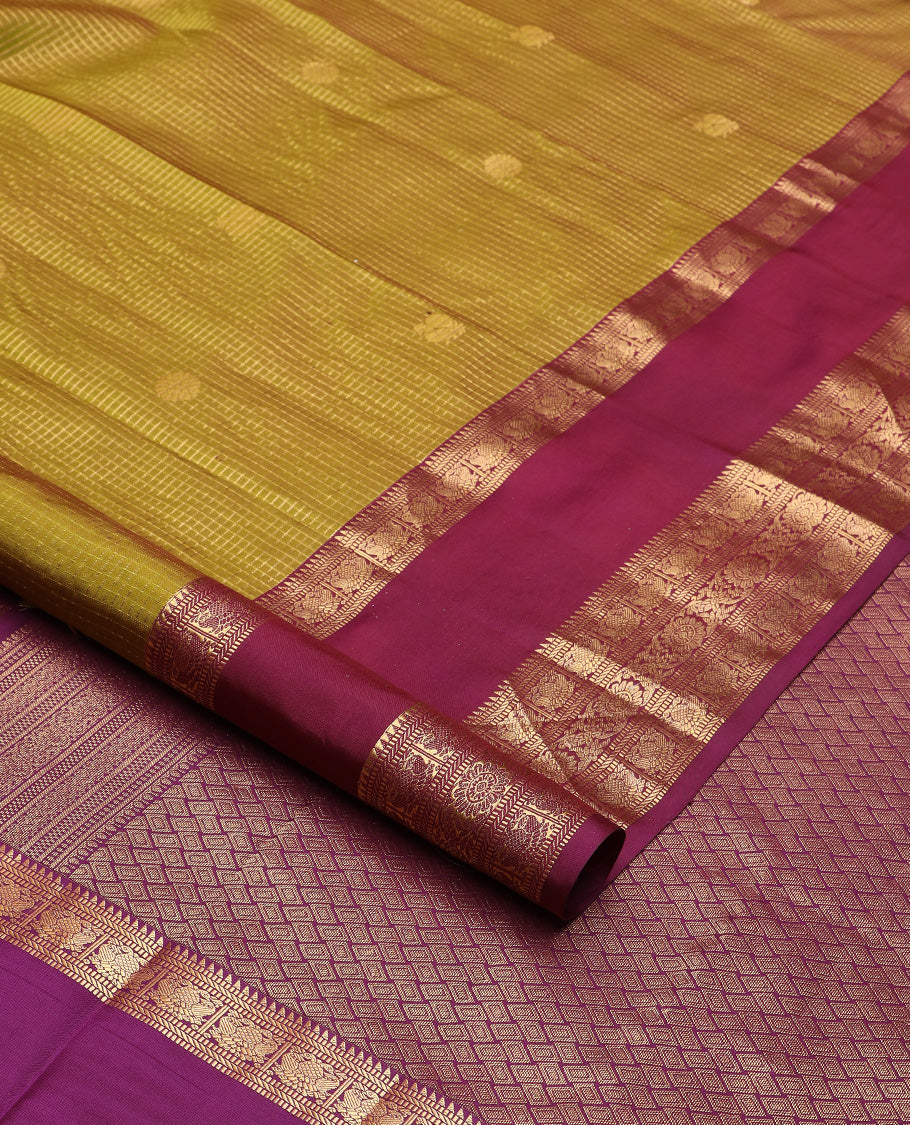 Green micro-checked with annam chakram buttas silk saree, contrast rettai pettu border of ara bogudi, muthu, banaras,iruthalai pakshi and poo chakram, and jaal pallu
