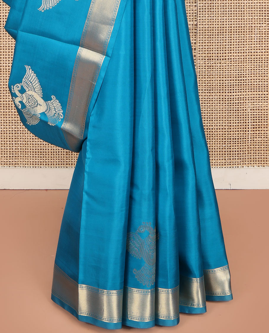 Blue Plain Vasundhara Silk Saree, Highlighted by Zari Border of Iruthalai Pakshi and Traditional Designs, Grand Jaal-Patterned Pallu, and Paired with a Matching Blouse