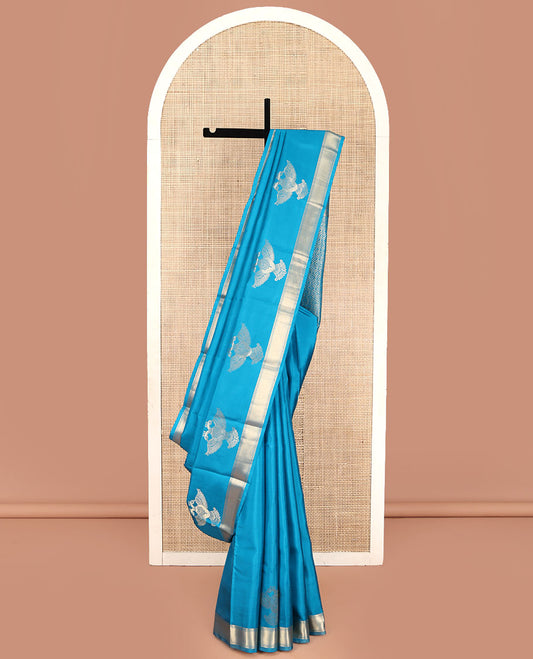 Blue Plain Vasundhara Silk Saree, Highlighted by Zari Border of Iruthalai Pakshi and Traditional Designs, Grand Jaal-Patterned Pallu, and Paired with a Matching Blouse