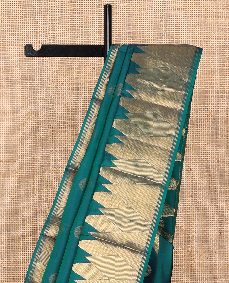Peacock blue chakram buttas silk saree, zari border of vanki, zari stripes & mayil kann designs & jaal pallu
