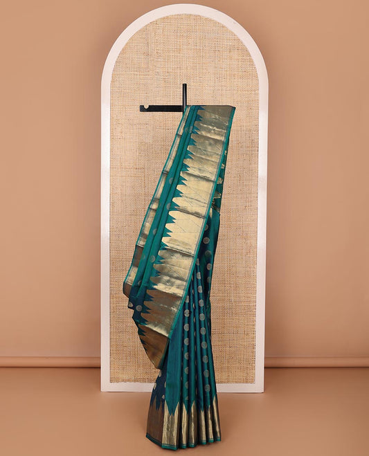 Peacock blue chakram buttas silk saree, zari border of vanki, zari stripes & mayil kann designs & jaal pallu
