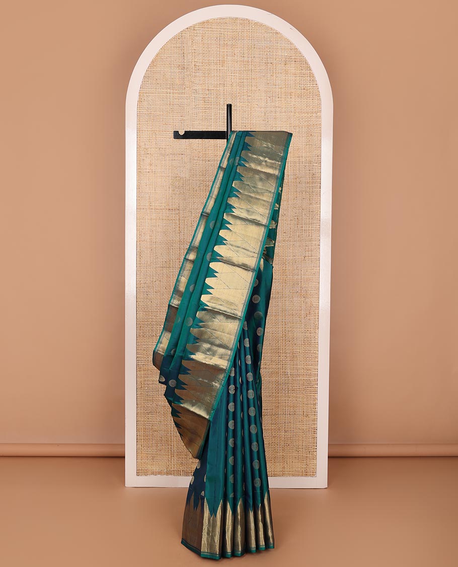 Peacock blue chakram buttas silk saree, zari border of vanki, zari stripes & mayil kann designs & jaal pallu