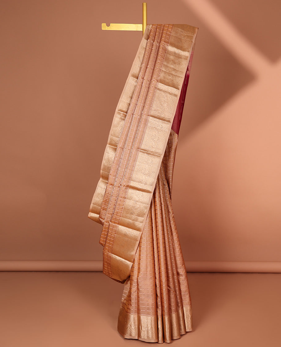 Brown checked silk saree with self border of thilakam mokku, poo chakram , mayil , manga designs & intricate zari pallu