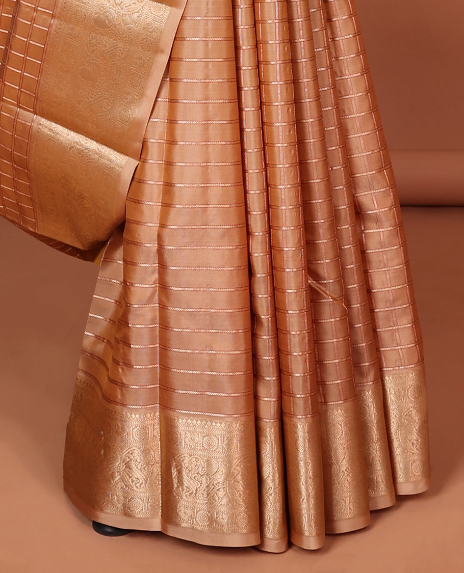 Brown checked silk saree with self border of thilakam mokku, poo chakram , mayil , manga designs & intricate zari pallu
