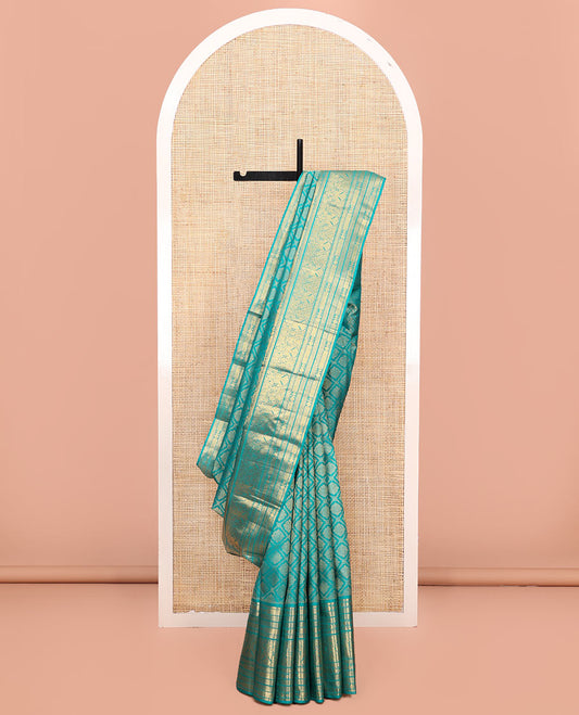 Blue Kanchipuram Wedding Silk Saree, Finely Crafted with Jacquard Design on Its Body, Highlighted by Zari Border of Mayil Kann, Rudraksham, Kamalam, and Iruthalai Pakshi Designs, Intricately Designed Pallu, and Paired with a Matching Blouse