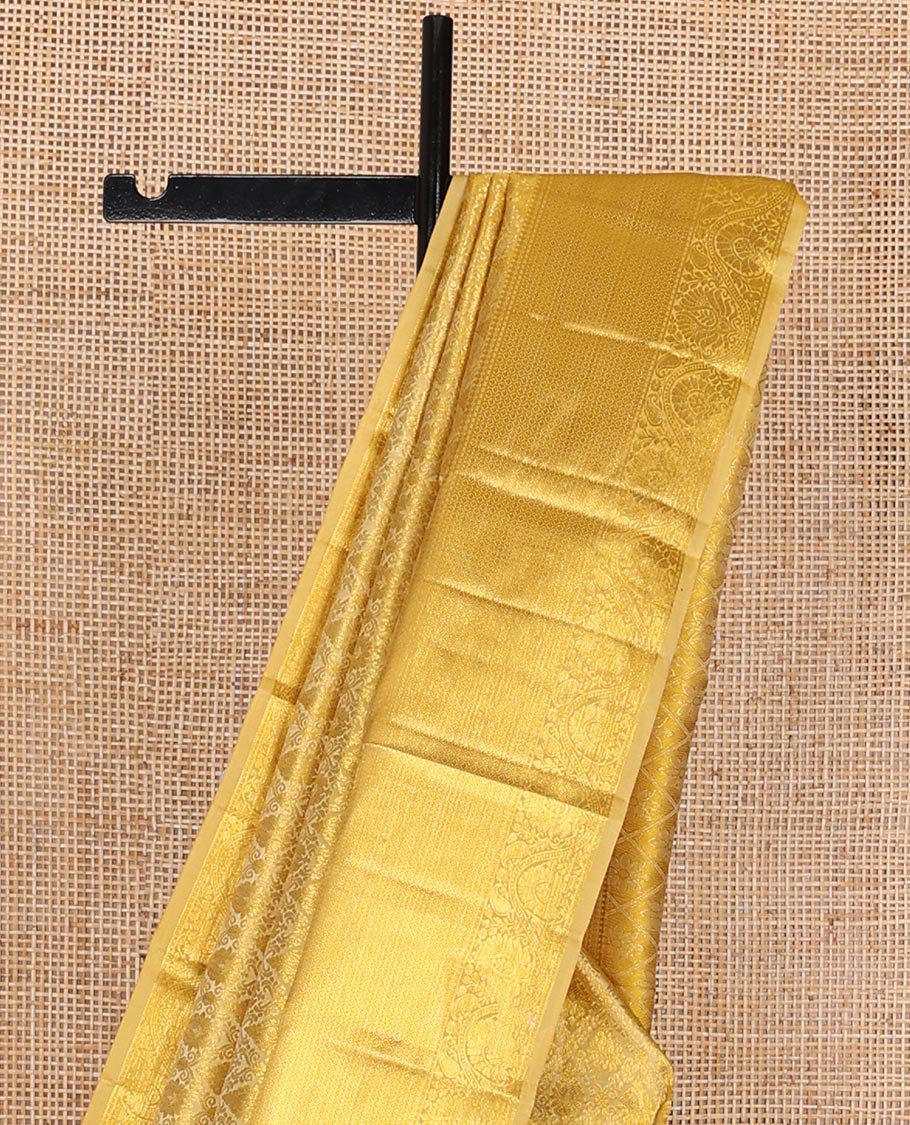Yellow jacquard kanchipuram wedding silk saree, zari border of traditional design & pallu of floral motif enclosed jaal design