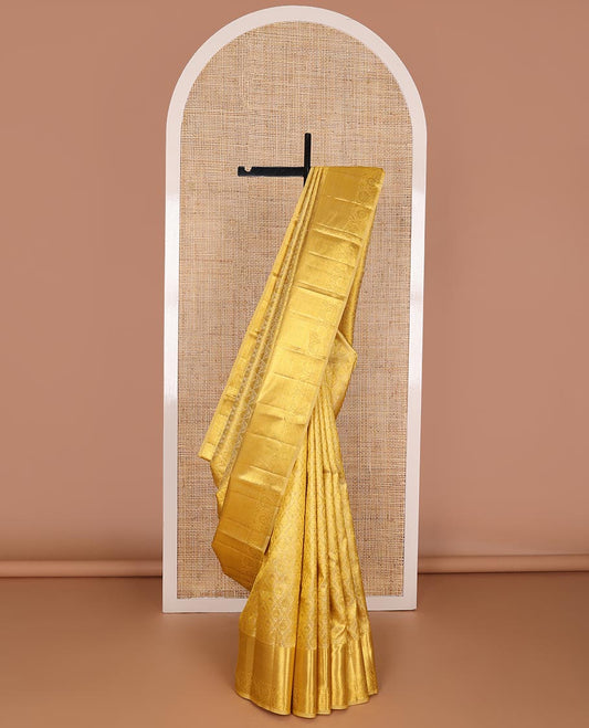 Yellow jacquard kanchipuram wedding silk saree, zari border of traditional design & pallu of floral motif enclosed jaal design