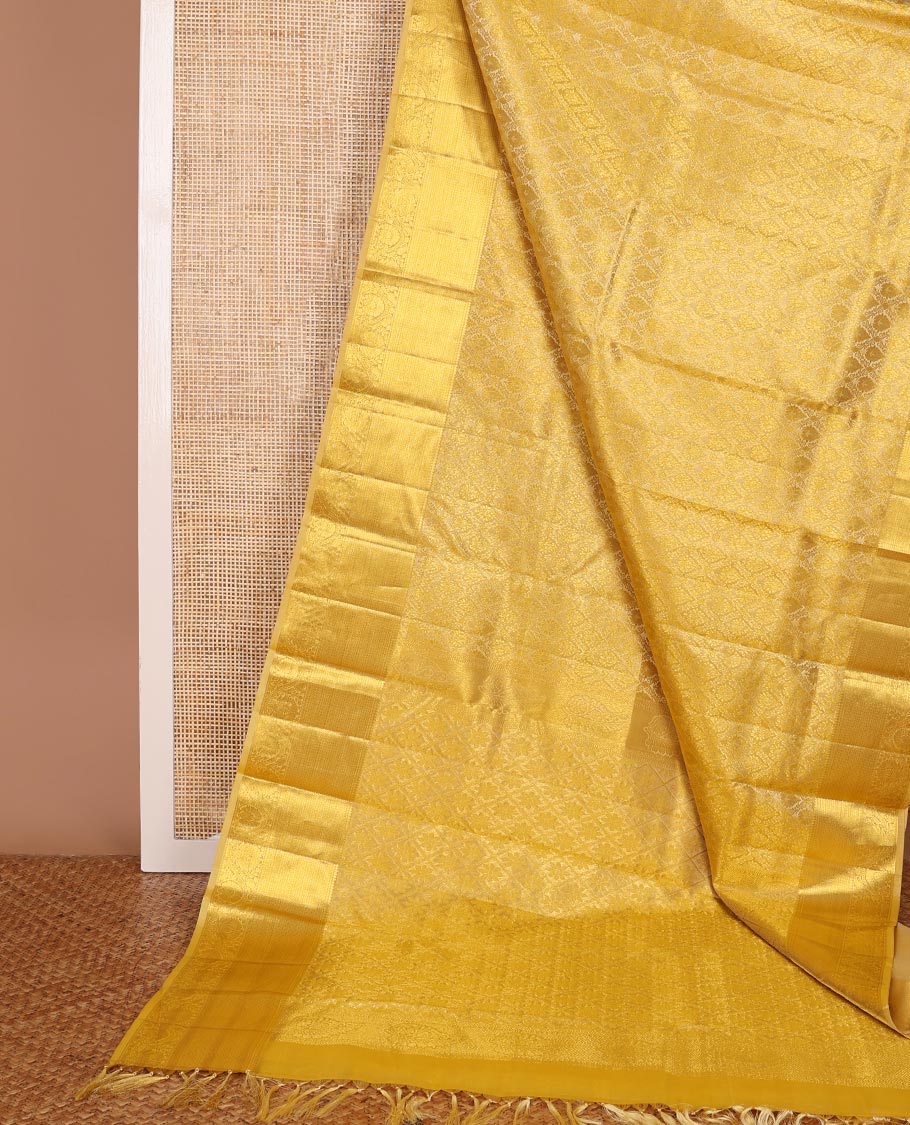 Yellow jacquard kanchipuram wedding silk saree, zari border of traditional design & pallu of floral motif enclosed jaal design