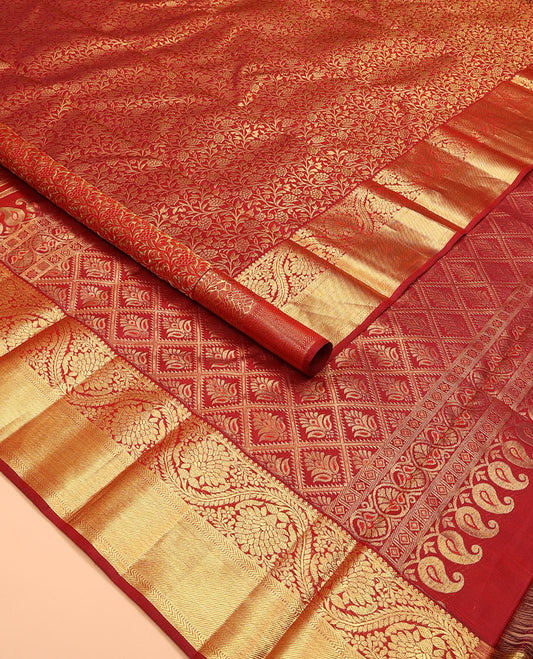 Red jacquard kanchipuram silk saree, zari border of thilakam, kathir, muthu, and dhavana kodi designs, and butta enclosed jaal pallu
