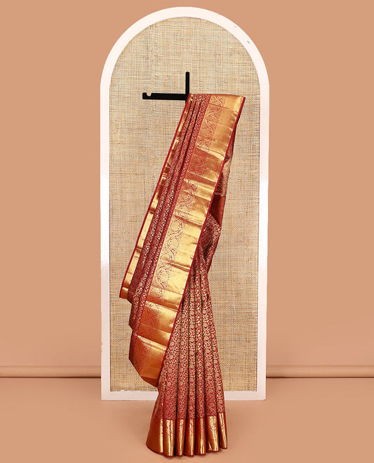 Red jacquard kanchipuram silk saree, zari border of thilakam, kathir, muthu, and dhavana kodi designs, and butta enclosed jaal pallu