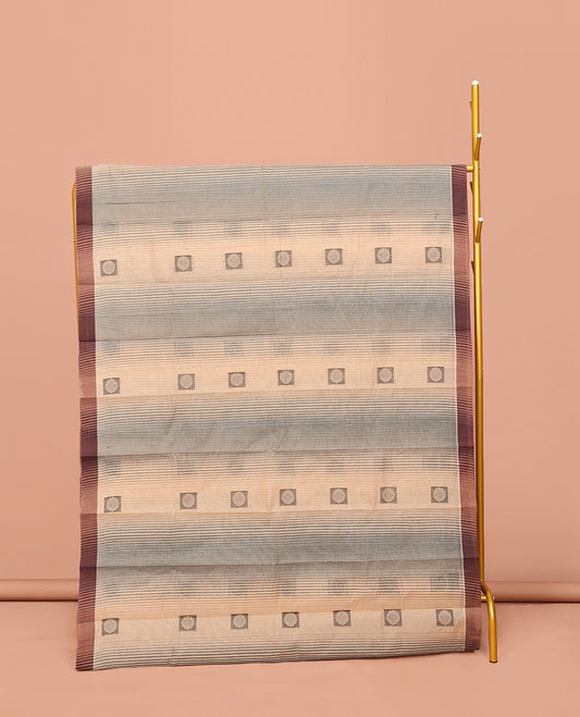 Sandal Kanchi Cotton Saree, Subtly Elevated with Buttas and Stripes All Over Its Body, Complemented by Contrast Border, Pallu of Jaal Designs, and Paired with a Matching Blouse