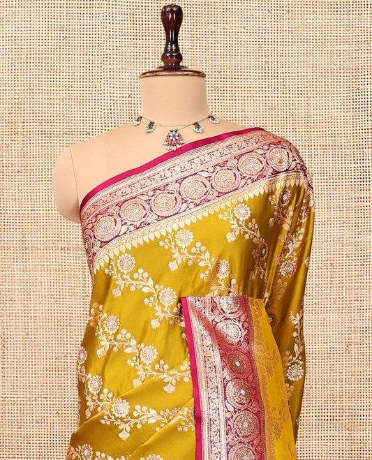 Yellow Banarasi Satin Saree, Majestically Detailed with Floral Jaal Jacquard, a Contrast Floral Creeper Border, Intricate Stonework Pallu, and a Contrast Blouse