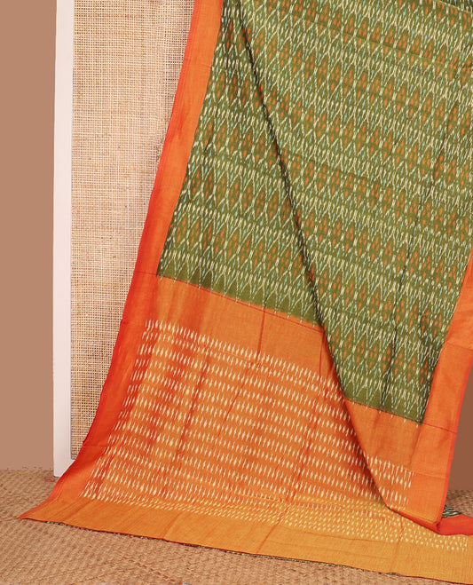 Green ogee patterned ikkat cotton saree, contrast plain border, and pallu of buttas