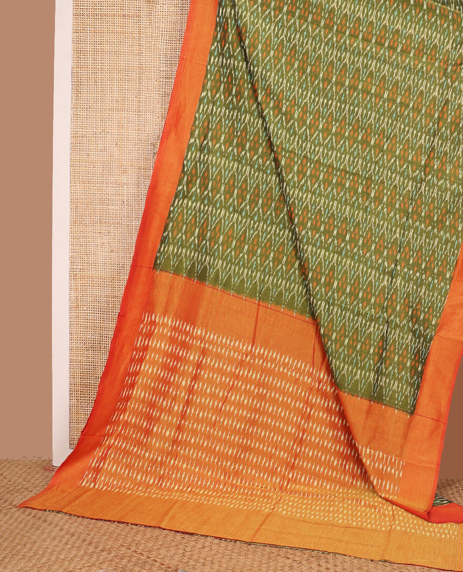 Green ogee patterned ikkat cotton saree, contrast plain border, and pallu of buttas