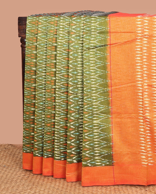 Green ogee patterned ikkat cotton saree, contrast plain border, and pallu of buttas