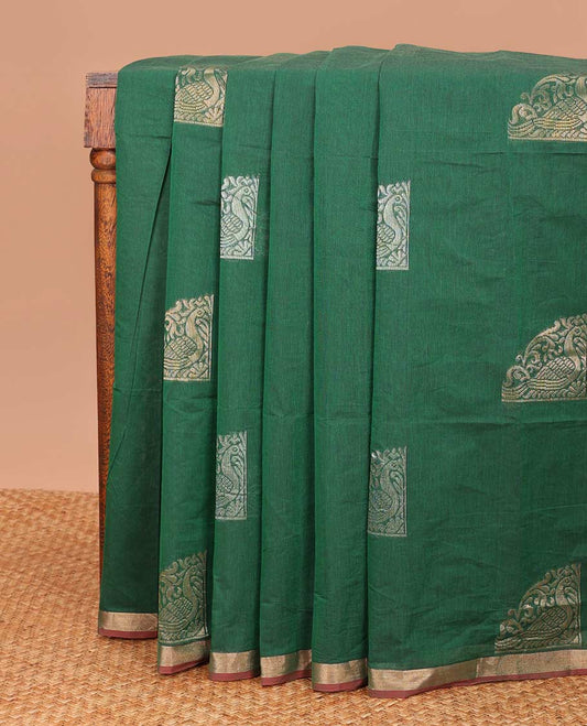 Green zari buttas Coimbatore cotton saree, zari piping border, and pallu of Mughal style peacock designs