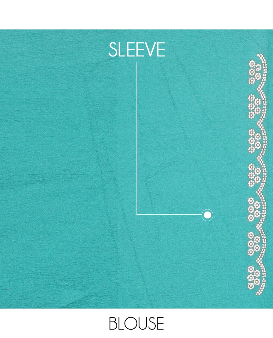 Green stone embroidered designer saree with stones embedded in its body, flower-shaped stone aligned scallop border