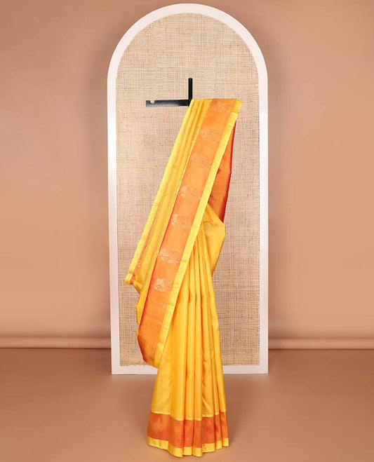 Yellow kancheepuram silk saree with contrast floral border & floral design pallu