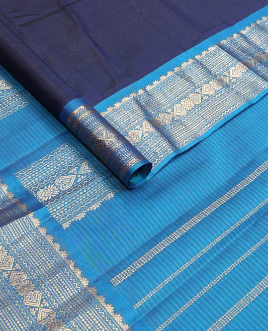 Blue striped & zari buttas silk saree, contrast border of thazampoo rekku,neli,muthu,chakram & jada nagam & zari design pallu