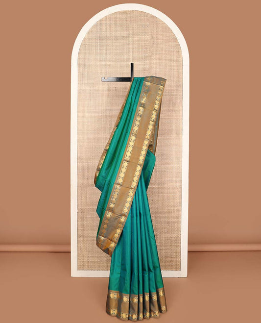 Green striped Kanchipuram silk saree, contrast rettai pettu border of rekku, and rudraksham designs, and zari striped pallu