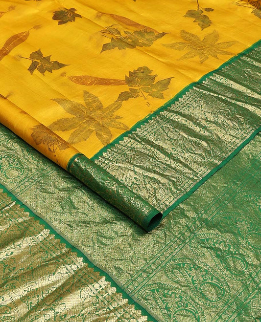Yellow floral printed silks saree, contrast zari border of rudraksham, banaras, mayil, yaanai, and yaali designs, and jaal pallu