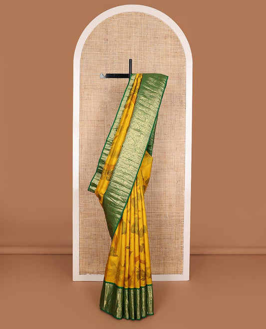 Yellow floral printed silks saree, contrast zari border of rudraksham, banaras, mayil, yaanai, and yaali designs, and jaal pallu