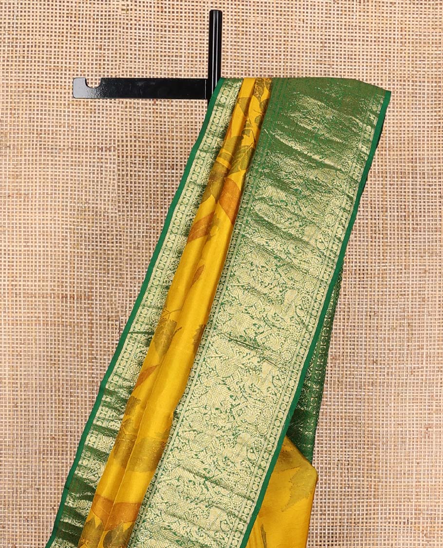 Yellow floral printed silks saree, contrast zari border of rudraksham, banaras, mayil, yaanai, and yaali designs, and jaal pallu