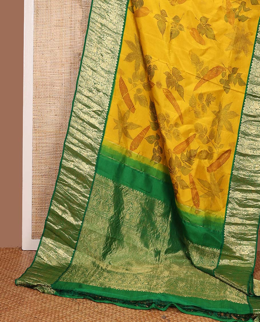 Yellow floral printed silks saree, contrast zari border of rudraksham, banaras, mayil, yaanai, and yaali designs, and jaal pallu