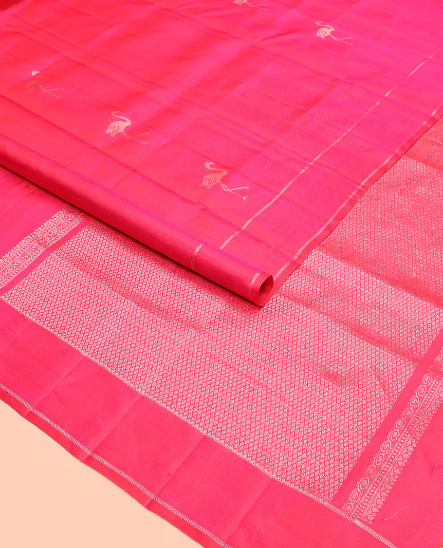 Pink flamingo zari buttas soft silk saree, zari striped border, and zari-rich jaal pallu