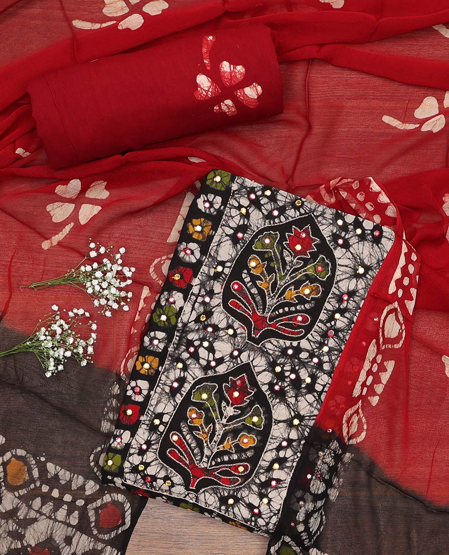 Black material churidar set, colorful batik print, thread outline embroidery, and mirror work cotton top, contrast batik printed cotton bottom, and batik printed chiffon dupatta