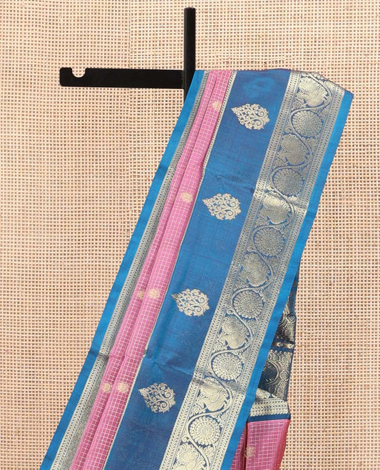 Pink Venkatagiri Silk Saree, Enlivened with Zari Buttas Enclosed Checks All Over Its Body, Complemented by a Contrast Traditional Zari Design Border of Peacock-Chakram Designs, Traditional Design Pallu, and Paired with a Contrast Blouse